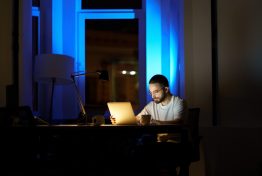 focused-young-businessman-in-eyeglasses-work-on-laptop-late-at-night-preparing-for-new-startup_t20_OJYY8L